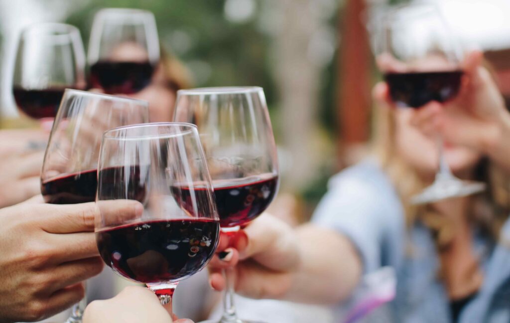 Cheers with Glasses of Red Wine
