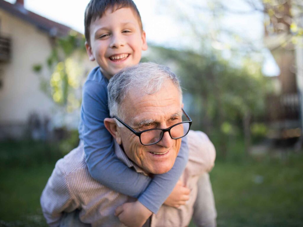 Happy grandfather with smiling grandson